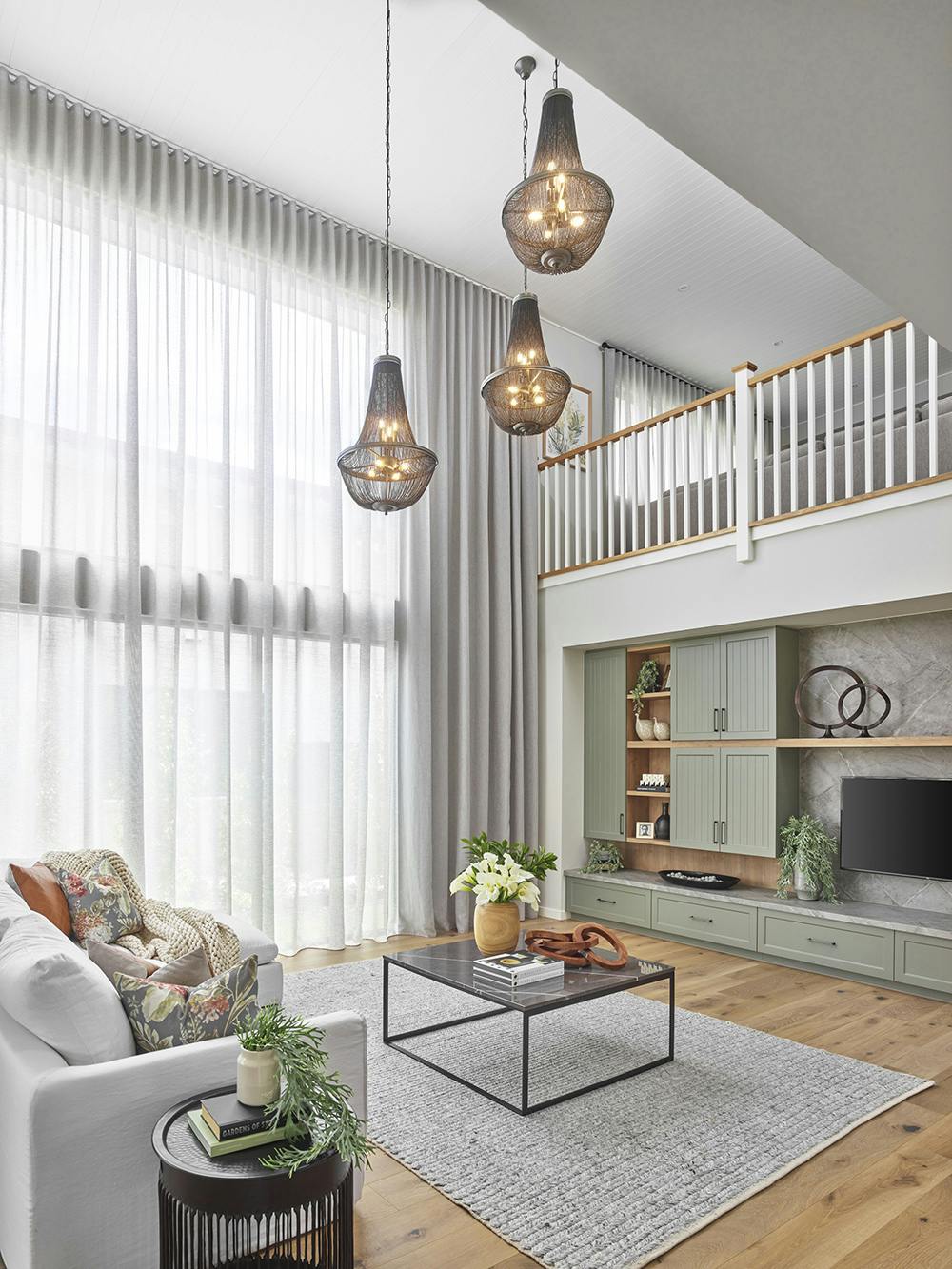 7. An open plan living area with a void on display at the Sovereign 54 in Greenvale, Victoria